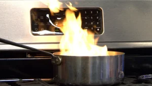flaming pan on stove top