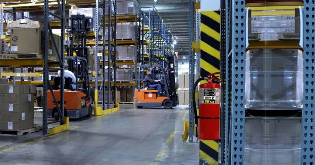 fire extinguisher next to warehouse rack