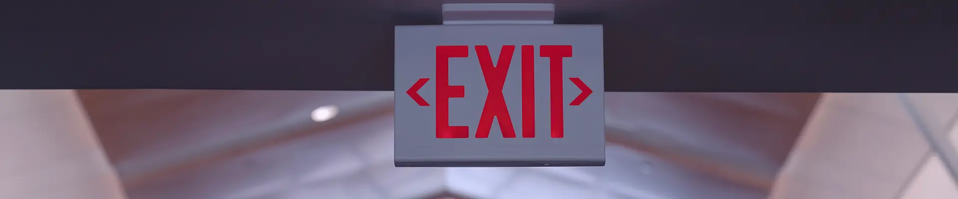 exit sign in long hallway