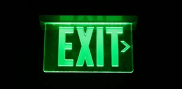 green glowing exit sign