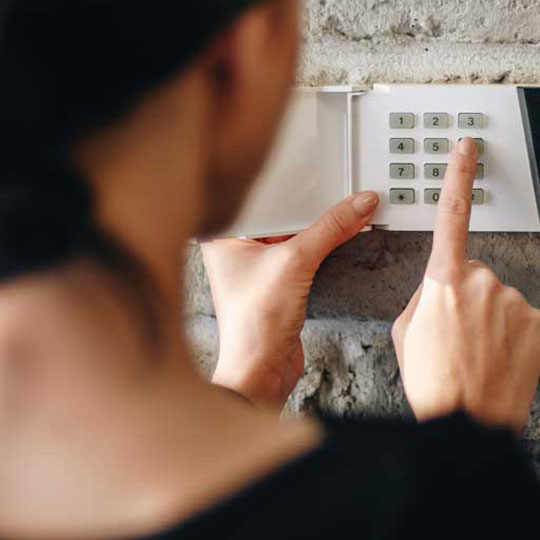 women setting alarm system