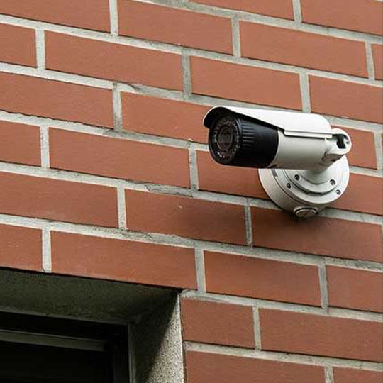 surveillance camera above door